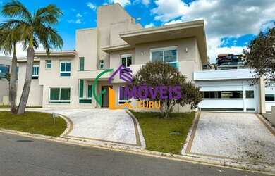 Imagem: A casa em condomínio possui 4 Dormitórios, 5 Banheiros, 3