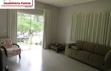 Imagem 14: Sobrado a venda no Ninho Verde, frente ao asfalto e lago do condomínio...