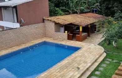 Imagem: A casa possui 4 Dormitórios, 5 Banheiros, 5 Vagas na garagem