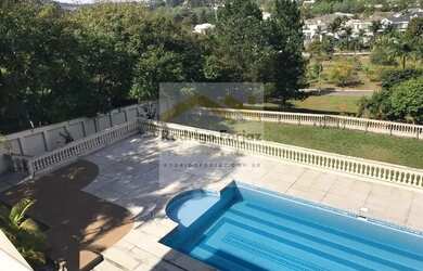 Imagem: A casa possui 5 Dormitórios, 5 Banheiros, 5 Vagas na garagem