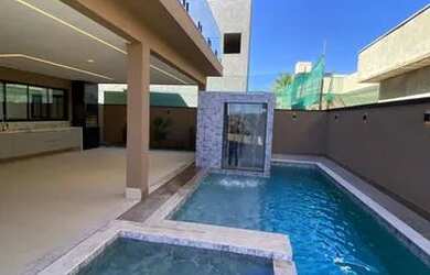 Imagem: A casa possui 4 Dormitórios, 5 Banheiros, 5 Vagas na garagem