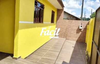 Imagem: A casa possui 4 Dormitórios, 2 Banheiros, 2 Vagas na garagem