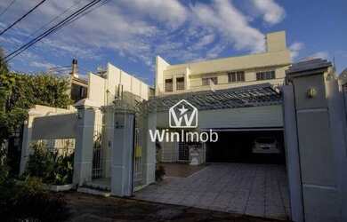 Imagem: A casa possui 5 Dormitórios, 5 Banheiros, 5 Vagas na garagem