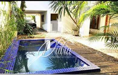 Imagem: A casa possui 5 Dormitórios, 5 Banheiros, 4 Vagas na garagem