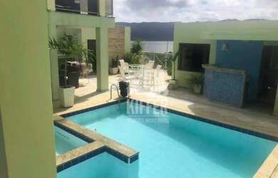 Imagem: A casa possui 5 Dormitórios, 5 Banheiros, 3 Vagas na garagem