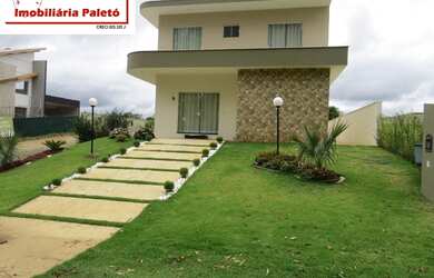 Imagem 2: Sobrado a venda no Ninho Verde, frente ao asfalto e lago do condomínio...