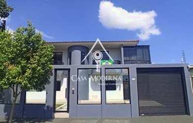 Imagem: A casa possui 3 Dormitórios, 4 Banheiros, 5 Vagas na garagem