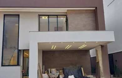 Imagem: A casa possui 3 Dormitórios, 5 Banheiros, 4 Vagas na garagem