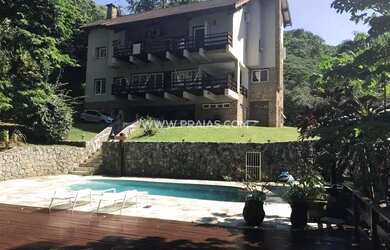 Imagem: A casa em condomínio possui 5 Dormitórios, 5 Banheiros, 4