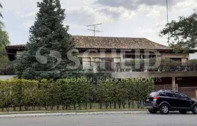 Imagem: A casa possui 5 Dormitórios, 5 Banheiros, 5 Vagas na garagem