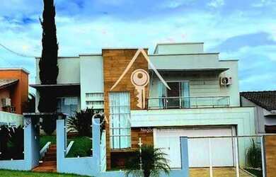 Imagem: A casa possui 2 Dormitórios, 1 Banheiro, 3 Vagas na garagem