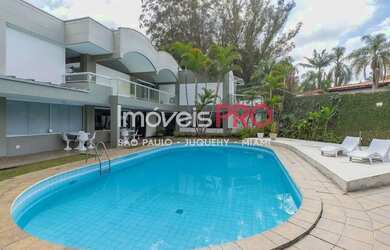 Imagem: A casa possui 3 Dormitórios, 5 Banheiros, 5 Vagas na garagem