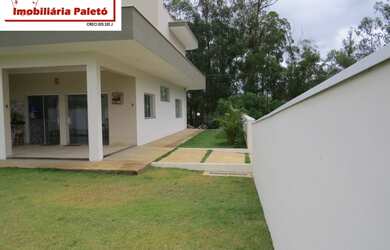 Imagem 7: Sobrado a venda no Ninho Verde, frente ao asfalto e lago do condomínio...