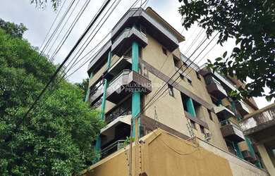 Imagem: O apartamento possui 1 Dormitório, 1 Banheiro, 1 Vaga na garagem