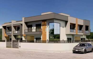 Imagem: A casa possui 2 Dormitórios, 3 Banheiros, 2 Vagas na garagem