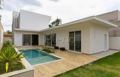 Imagem: A casa possui 4 Dormitórios, 5 Banheiros, 2 Vagas na garagem