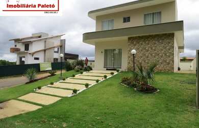 Imagem 1: Sobrado a venda no Ninho Verde, frente ao asfalto e lago do condomínio...