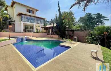 Imagem: A casa possui 3 Dormitórios, 5 Banheiros, 5 Vagas na garagem