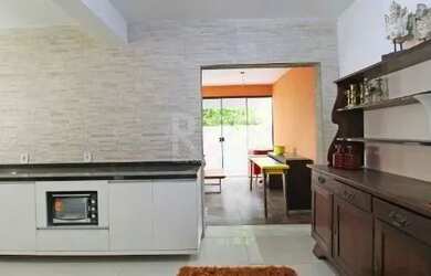 Imagem 13: Casa em Porto Alegre, no bairro Hípica, com 3 dormitório s , e 3 banheiros,...