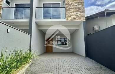 Imagem: A casa possui 3 Dormitórios, 3 Banheiros, 2 Vagas na garagem