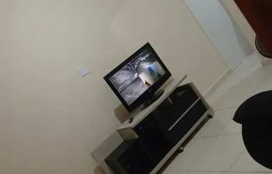 Imagem: A casa possui 2 Dormitórios, Acomodam 10 pessoas, 2 Vagas na