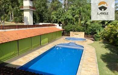 Imagem: A casa em condomínio possui 4 Dormitórios, 5 Banheiros, 5