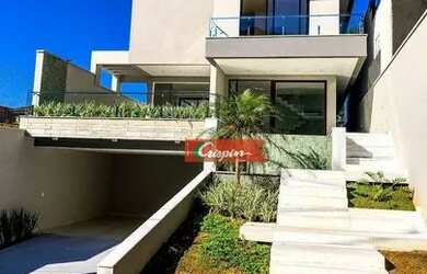 Imagem: A casa em condomínio possui 4 Dormitórios, 5 Banheiros, 5