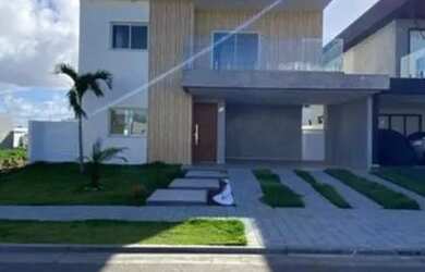 Imagem: A casa possui 3 Dormitórios, 5 Banheiros, 4 Vagas na garagem