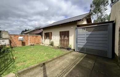 Imagem: A casa possui 2 Dormitórios, 2 Banheiros, 1 Vaga na garagem