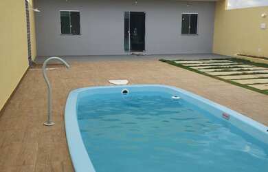 Imagem: A casa possui 2 Dormitórios, 2 Banheiros, 3 Vagas na garagem