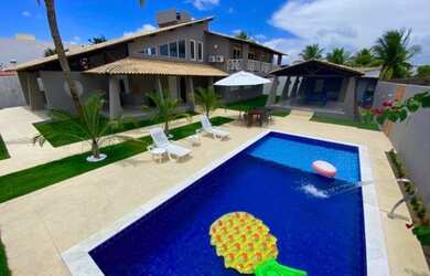 Imagem: A casa possui 5 Dormitórios, 4 Vagas na garagem e está localizado