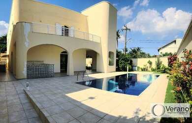 Imagem: A casa possui 5 Dormitórios, 5 Banheiros, 4 Vagas na garagem