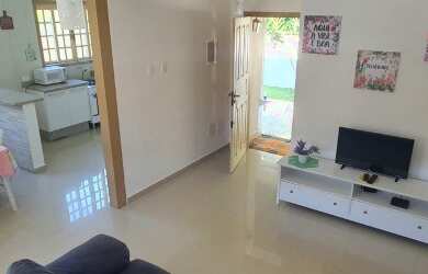 Imagem: A casa possui 2 Dormitórios, 4 Vagas na garagem e está localizado