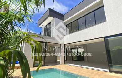 Imagem: A casa possui 4 Dormitórios, 5 Banheiros, 4 Vagas na garagem