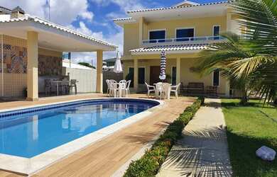 Imagem: A casa possui 5 Dormitórios, 5 Banheiros, 3 Vagas na garagem