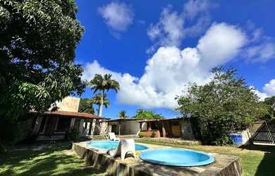 Imagem: A casa possui 3 Dormitórios, 5 Vagas na garagem e está localizado