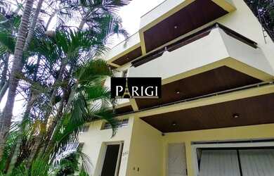 Imagem: A casa possui 3 Dormitórios, 5 Banheiros, 3 Vagas na garagem