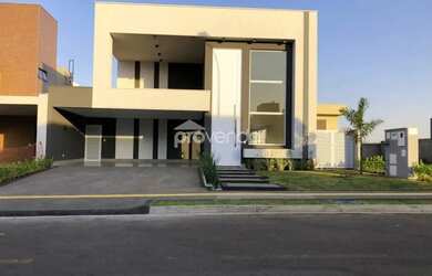 Imagem: A casa possui 4 Dormitórios, 5 Banheiros, 4 Vagas na garagem