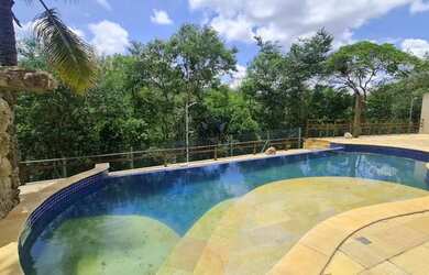 Imagem: A casa possui 5 Dormitórios, 5 Banheiros, 5 Vagas na garagem