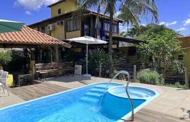 Imagem: A casa possui 3 Dormitórios, 3 Vagas na garagem e está localizado