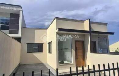 Imagem: A casa possui 2 Dormitórios, 1 Banheiro, 1 Vaga na garagem