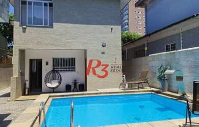 Imagem: A casa possui 3 Dormitórios, 4 Banheiros, 5 Vagas na garagem