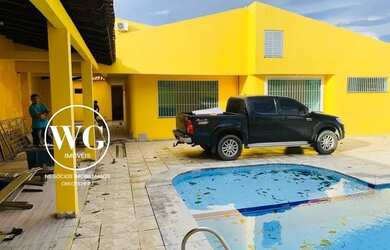 Imagem: A casa possui 4 Dormitórios, 3 Banheiros, 3 Vagas na garagem