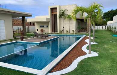 Imagem: A casa possui 5 Dormitórios e está localizado em Barra do