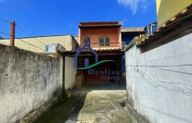 Imagem: A casa possui 2 Dormitórios, 1 Banheiro, 1 Vaga na garagem