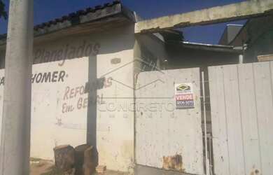 Imagem: A casa possui 3 Dormitórios, 1 Banheiro, 2 Vagas na garagem