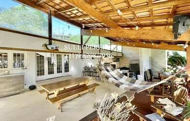 Imagem: A casa possui 3 Dormitórios, 5 Banheiros, 5 Vagas na garagem