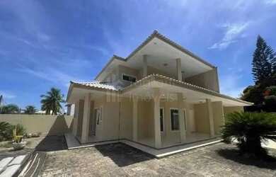 Imagem: A casa e possui 4 Dormitórios, Suítes, 5 Banheiros, 4 Vagas