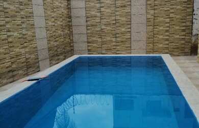 Imagem: A casa possui 4 Dormitórios, 4 Banheiros, 2 Vagas na garagem