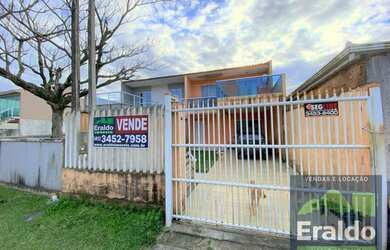 Imagem: A casa possui 5 Dormitórios, 2 Banheiros, 2 Vagas na garagem